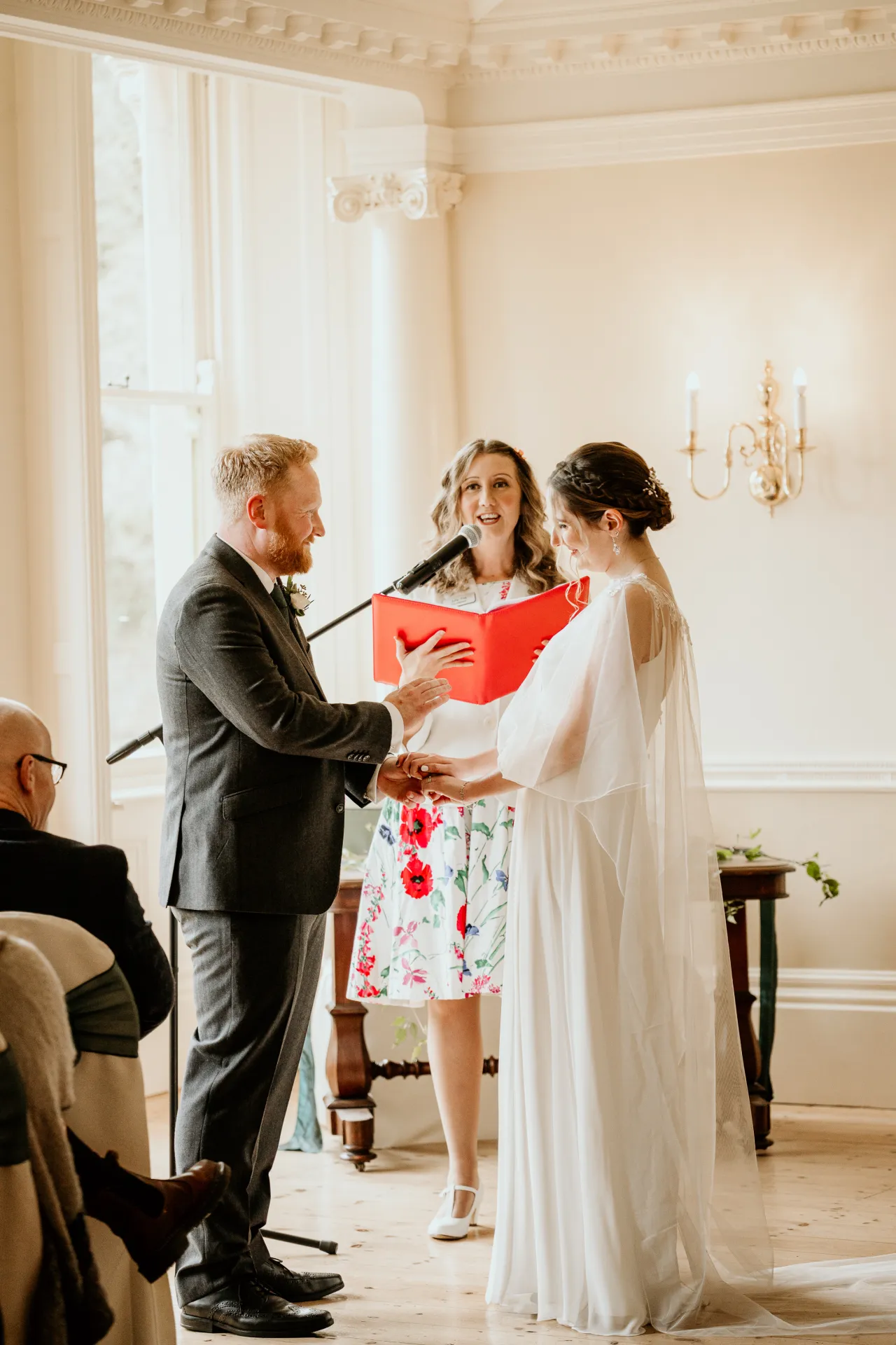 Emily and Owen exchanging vows with celebrant Julie Fox
