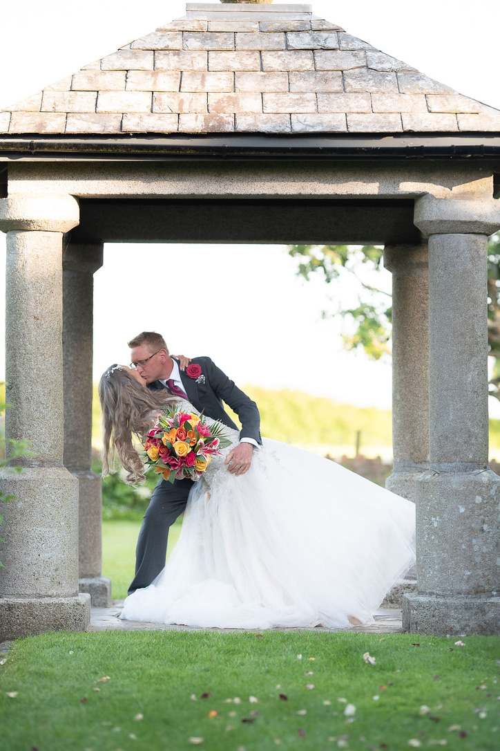 Julie Fox and her husband beneath the stone temple at Glebe Barn