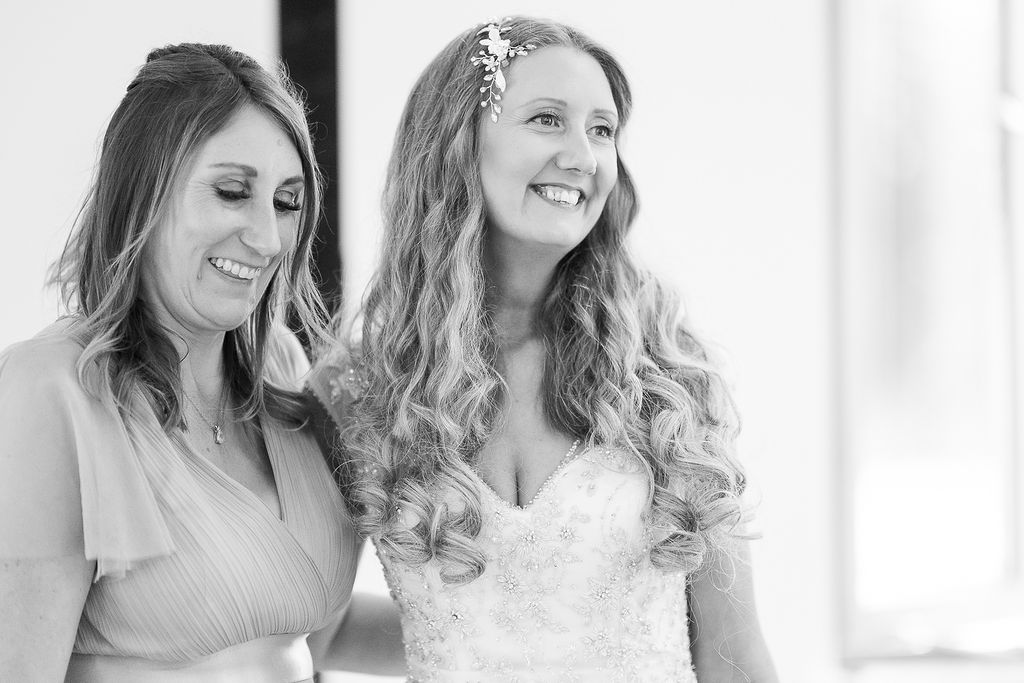 Julie Fox with her bridesmaid on her wedding day, in black and white