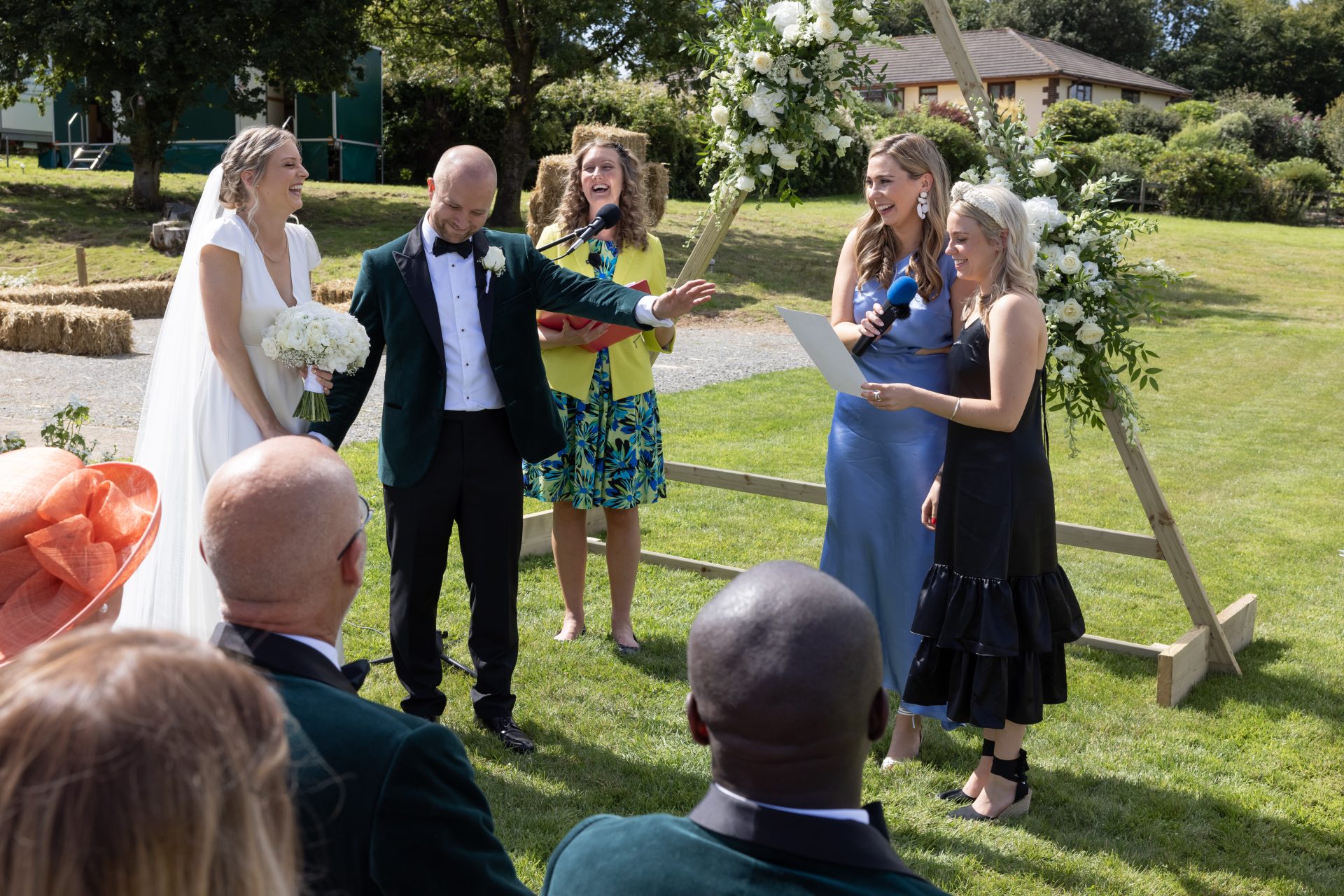 Julie Fox leading Lucy and Beau's garden wedding ceremony in Stoodleigh