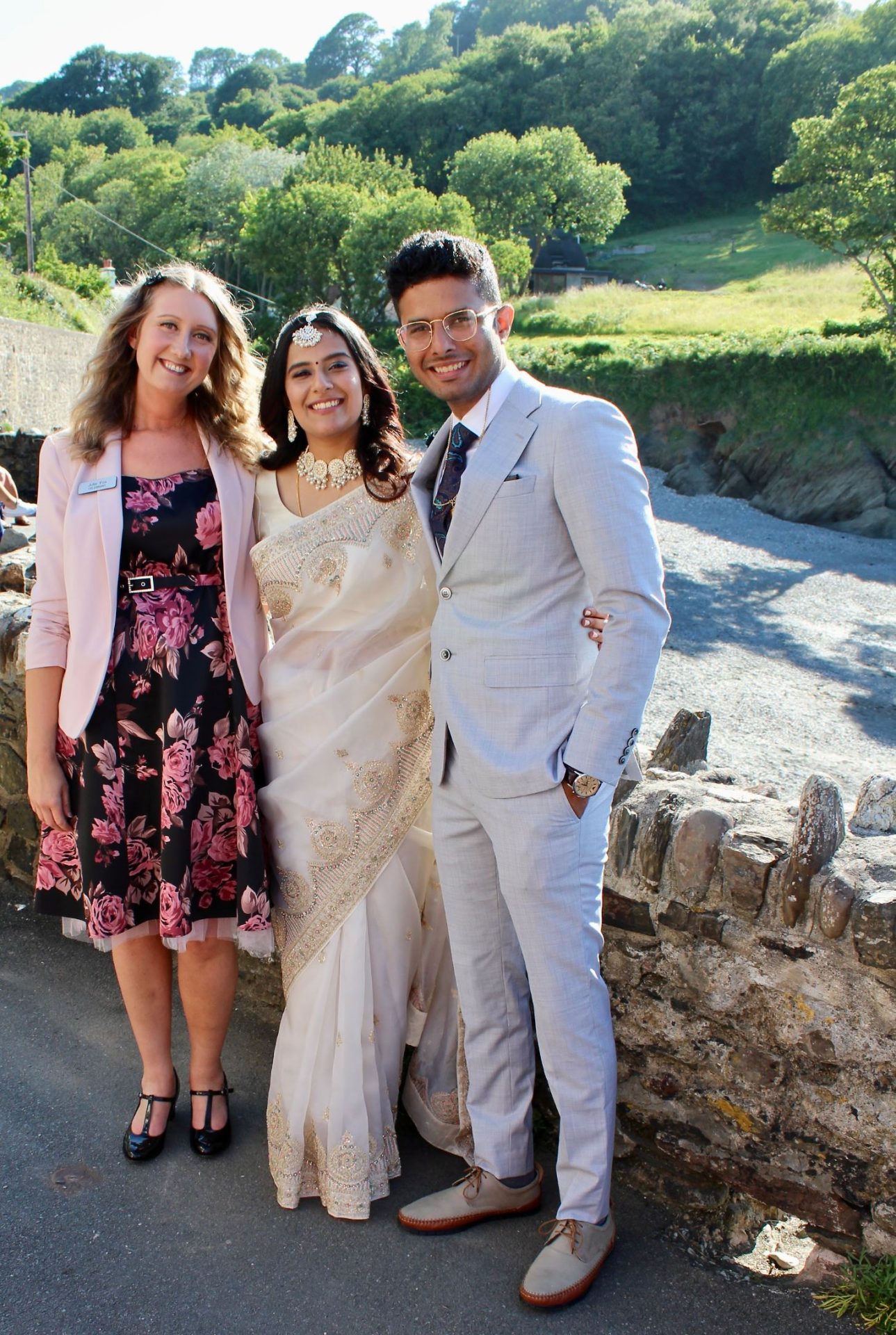 Julie Fox with Mansa and Albin on their wedding day at Arches Beach, Combe Martin